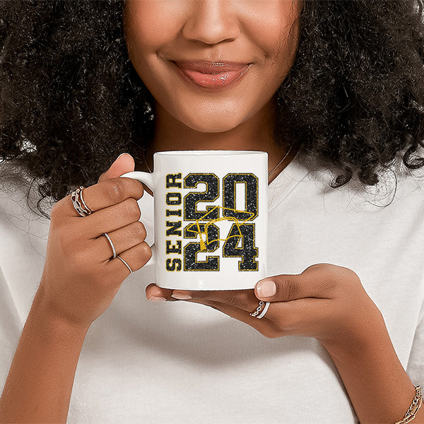 Woman holding a senior 2024 coffee mug, a gift designed for 2024 graduation. This gift can be a graduation gift for him or her. All SKUs. 