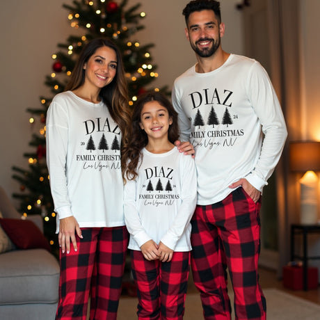 Custom family matching Christmas pajamas. Personalized Christmas sweatshirts with last name and location, paired with red and black plaid pajamas. Sizes available from newborn to 5XL. 