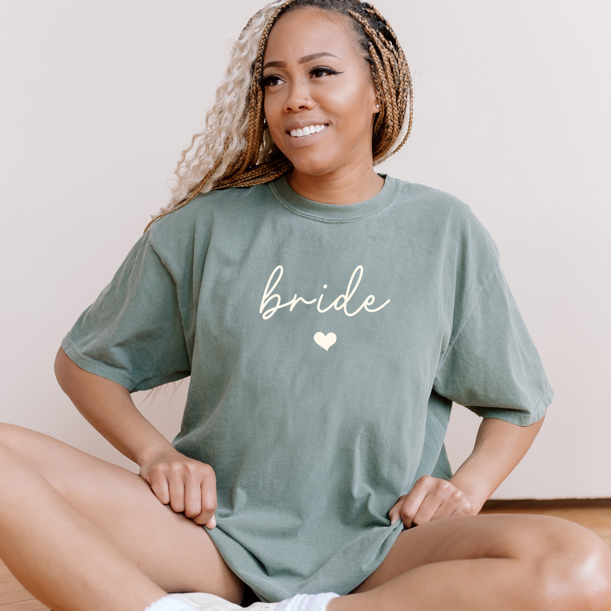Woman wearing a custom Comfort Colors oversized bride shirt. It is styled casually as a bachelorette party shirt.