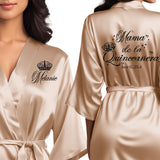 Personalized satin mama de la quinceanera robes. Champagne gold quince robes with black glitter design. 