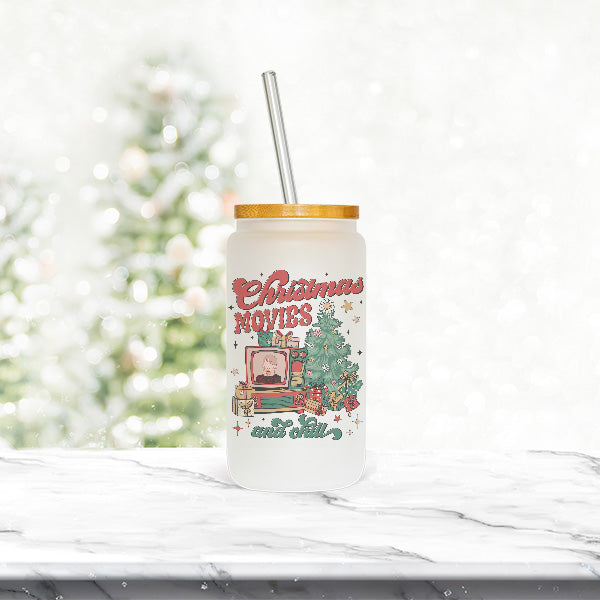 The Christmas design on this libbey glass can features a Christmas tree, television set, presents and the phrase is Christmas Movies and Chill