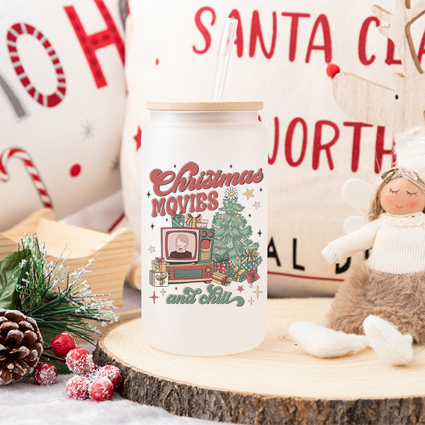 Christmas Iced Coffee Glass Can with Lid and Straw featuring a vintage nostalgic scene with trimmed Christmas tree and old school boxed tv with lots of presents.