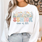 Girl wearing Floral 2025 Comfort Colors sweatshirt. Class of 2025 graduate in Floral Pastel Comfort Colors sweatshirt, perfect for graduation.