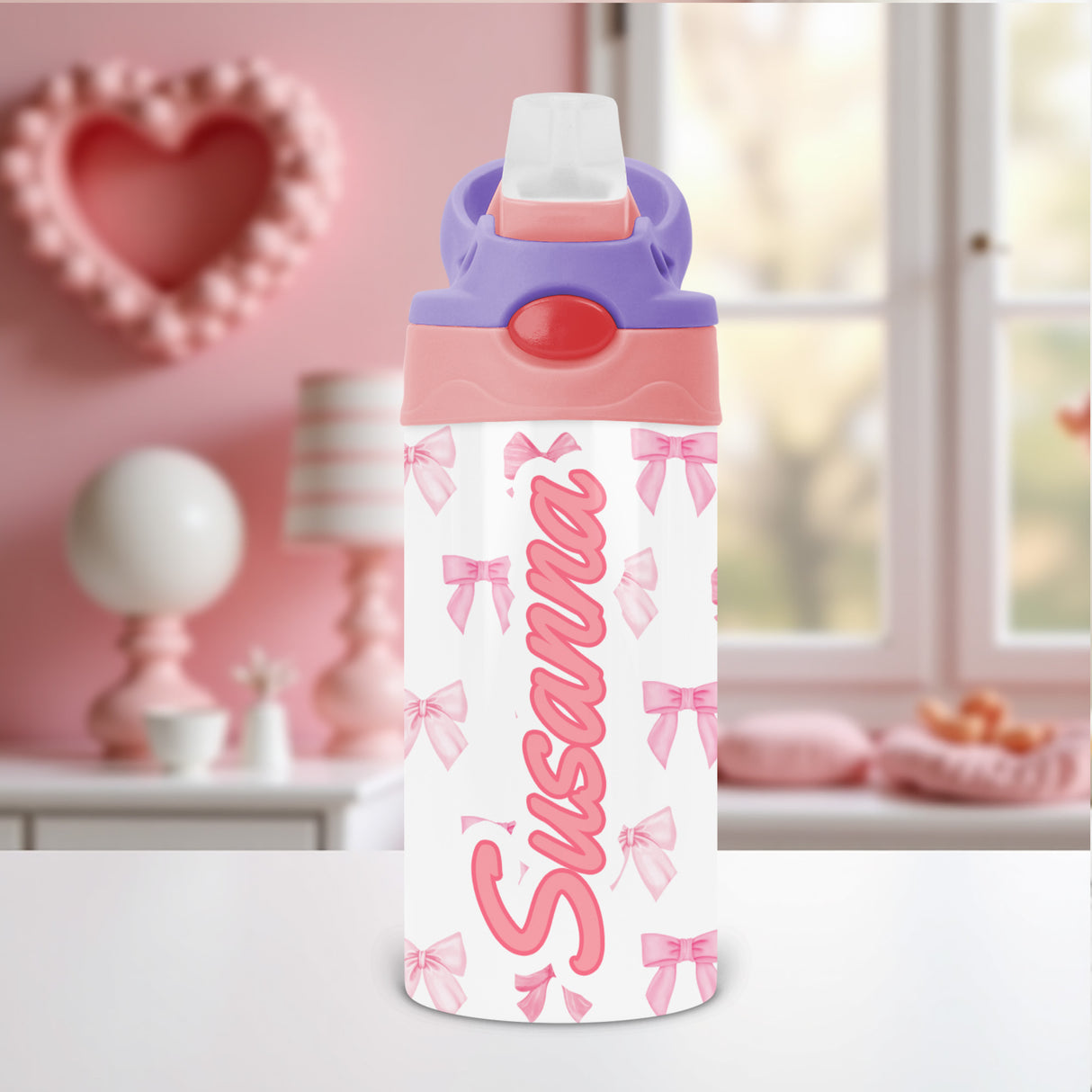 Coquette bow kids water bottle personalized with custom name and flip top lid, perfect for school or daycare hydration.