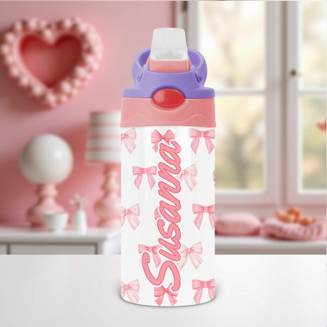 Coquette bow kids water bottle personalized with custom name and flip top lid, perfect for school or daycare hydration.