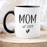Personalized baby feet coffee mug with sentimental design, a thoughtful gift for expecting mothers or new parents.