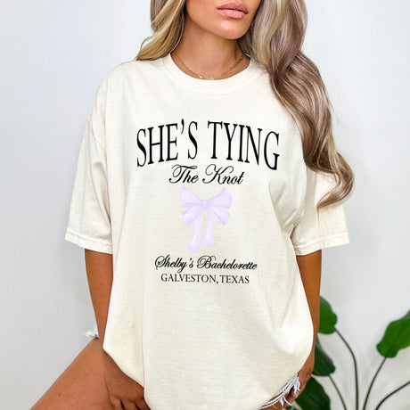 Custom Comfort Colors bachelorette party shirts with fun knot design and personalized names, perfect for matching bride squad outfits.