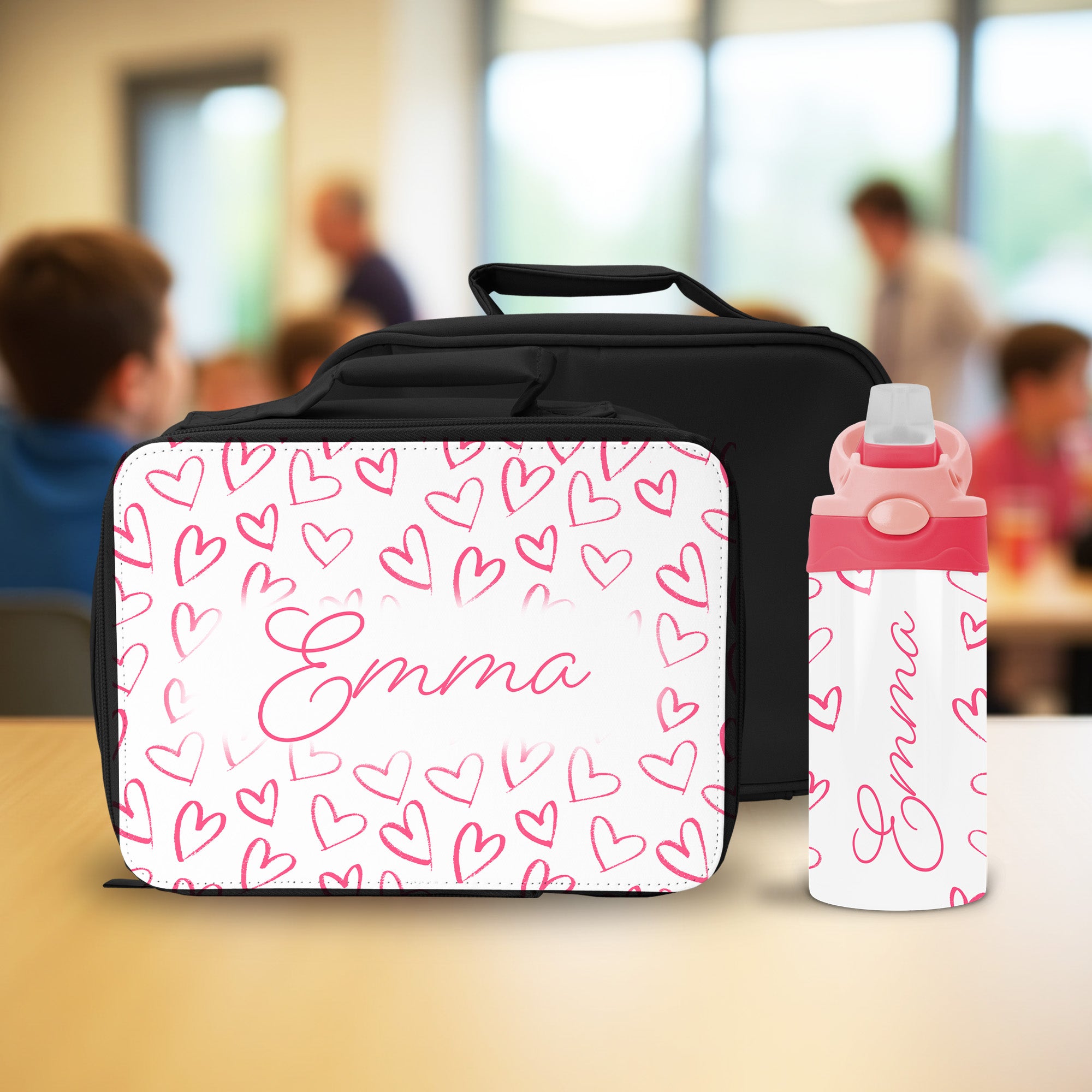 This personalized pink lunch box and water bottle set with name and heart design is perfect for girls going back to school.