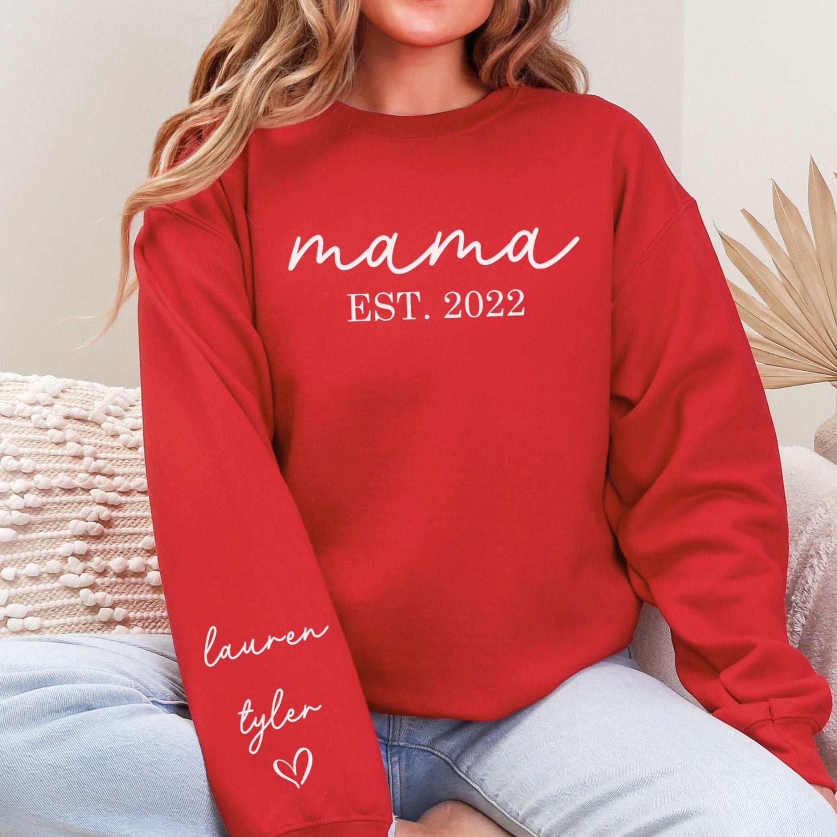 Cozy red personalized Mama Sweatshirt with kids' names on the sleeve, perfect Mother's Day gift.