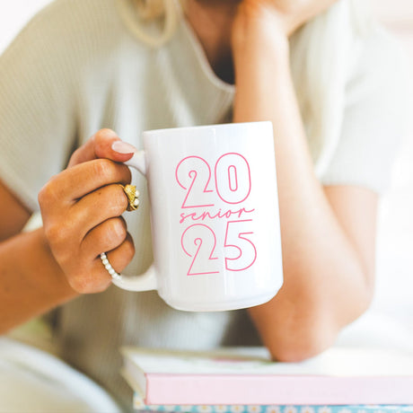 Modern senior mug for 2025 graduates, clean minimalist design. Graduation gift mug with minimalistic pink Class of 2025 lettering.