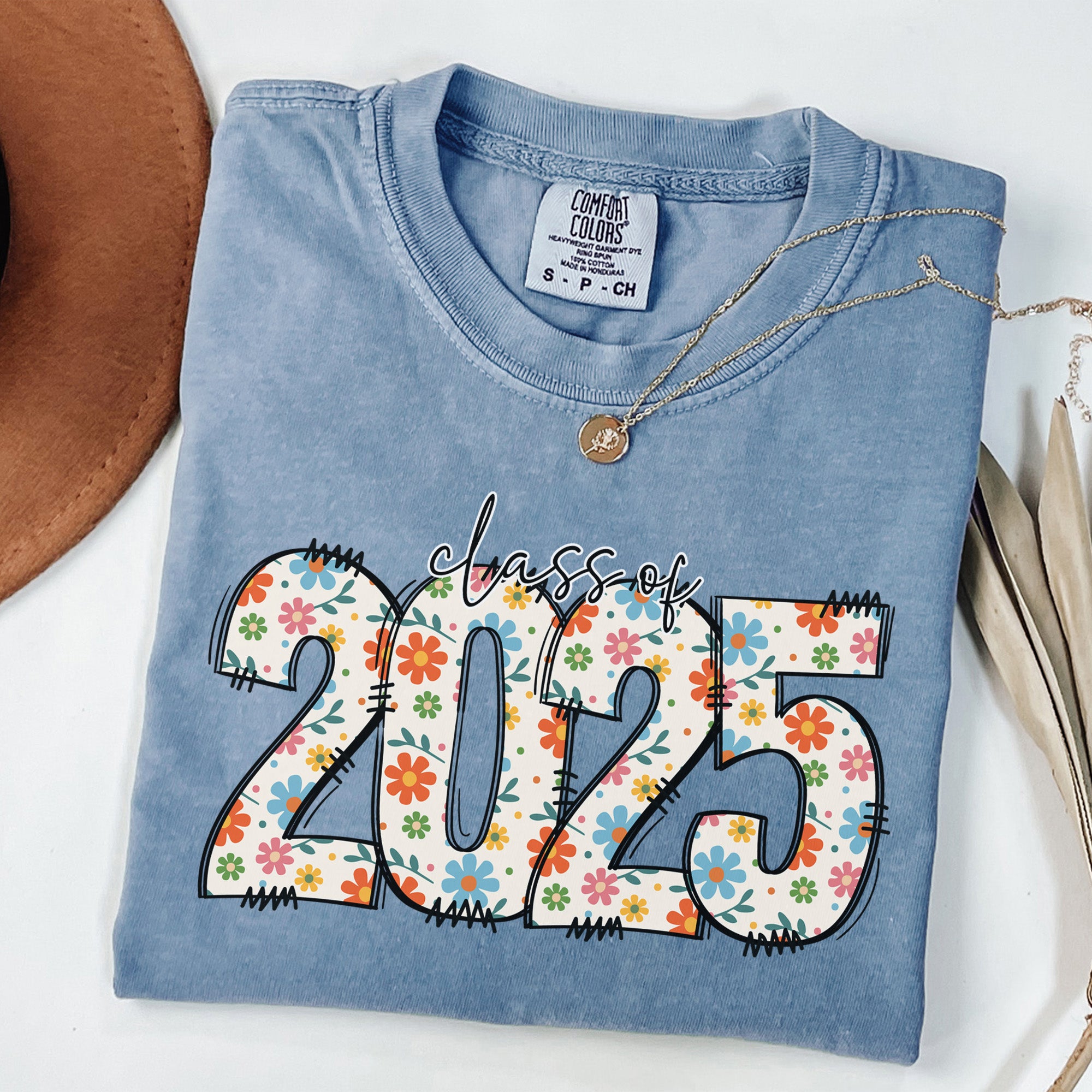 Comfort Colors graduation shirt gift ideas for college graduates. Cute floral Comfort colors graduation shirt for her. 