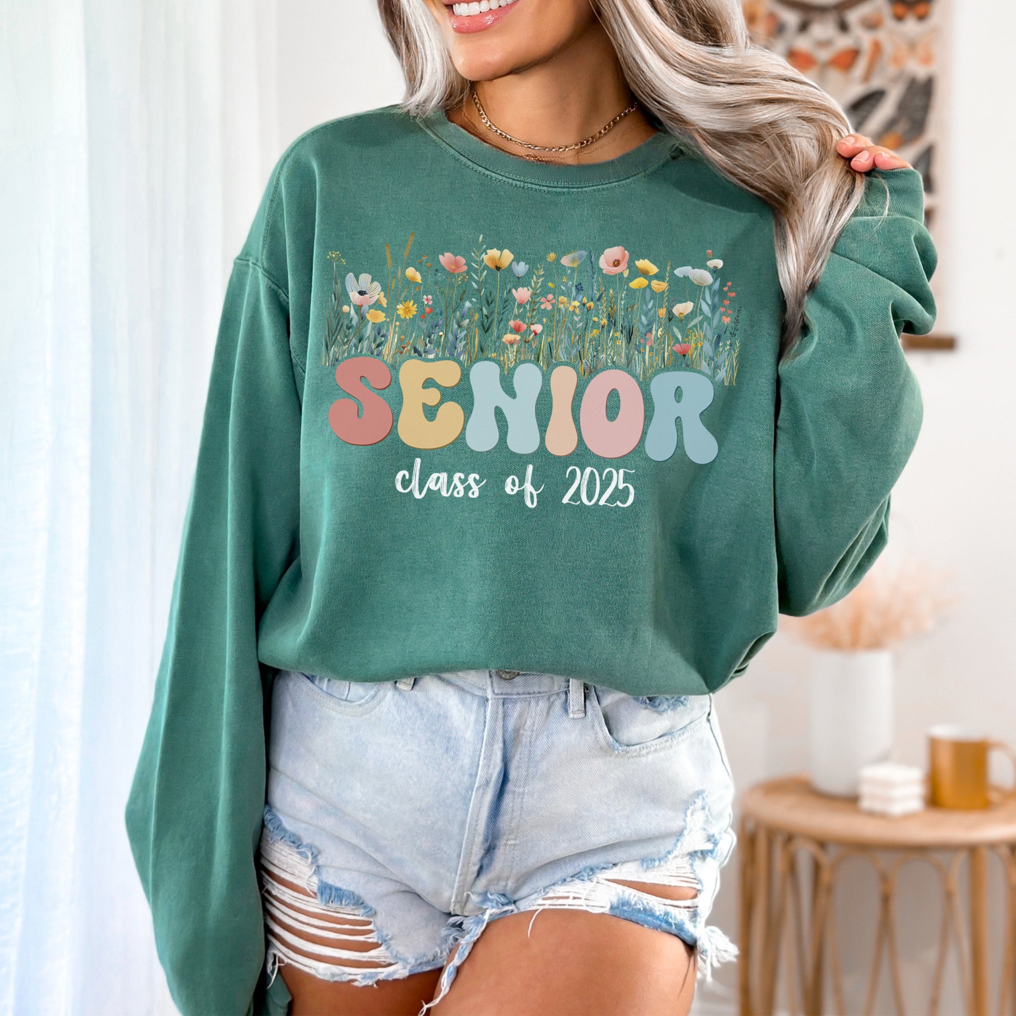 Custom Floral Pastel sweatshirt worn by girl, celebrating her Class of 2025 graduation.