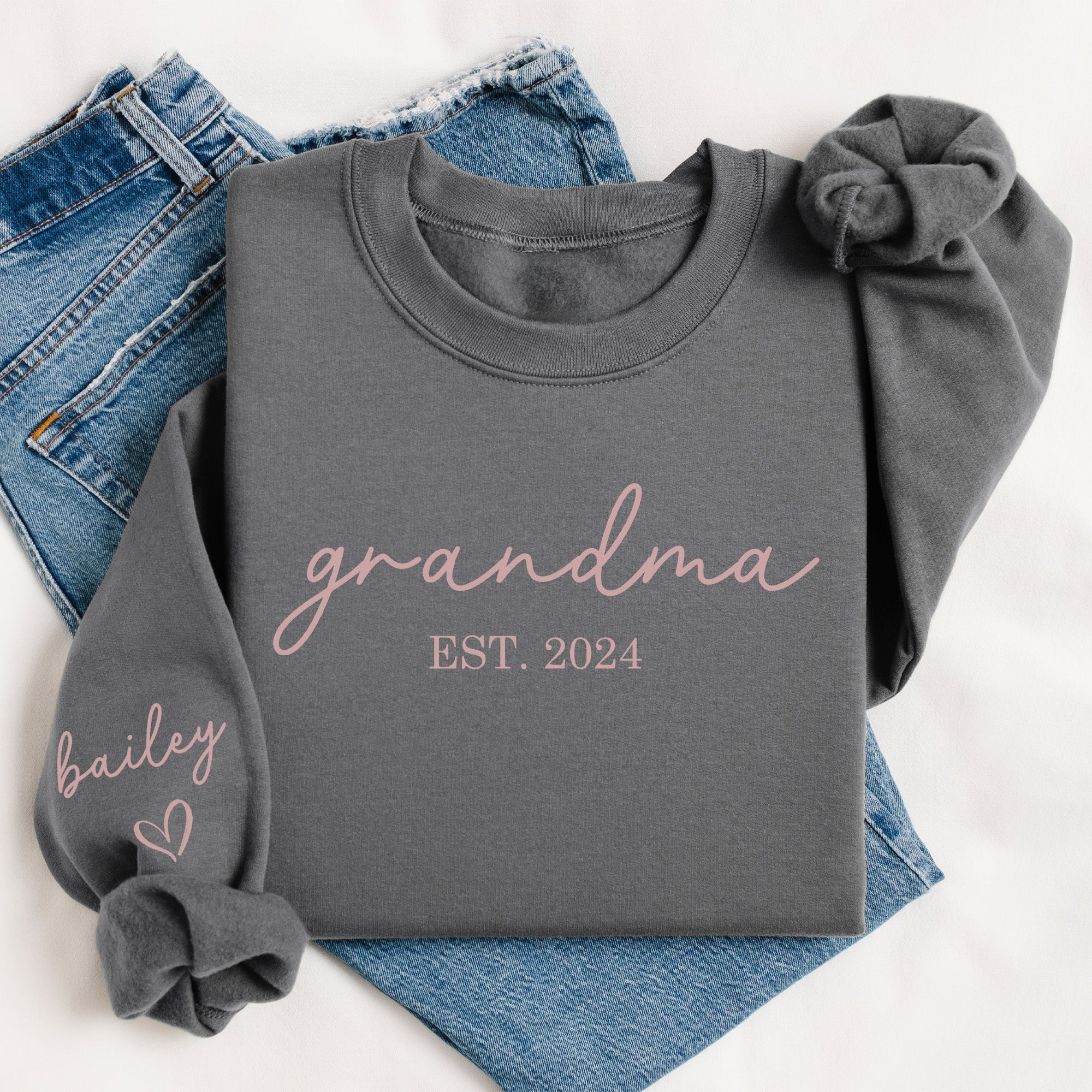 Close up of sleeve names on custom grandmother sweatshirt, great for gifting. Soft fleece grandma sweatshirt with personalized sleeve, birthday gift for Nana.
