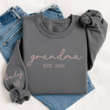 Close up of sleeve names on custom grandmother sweatshirt, great for gifting. Soft fleece grandma sweatshirt with personalized sleeve, birthday gift for Nana.