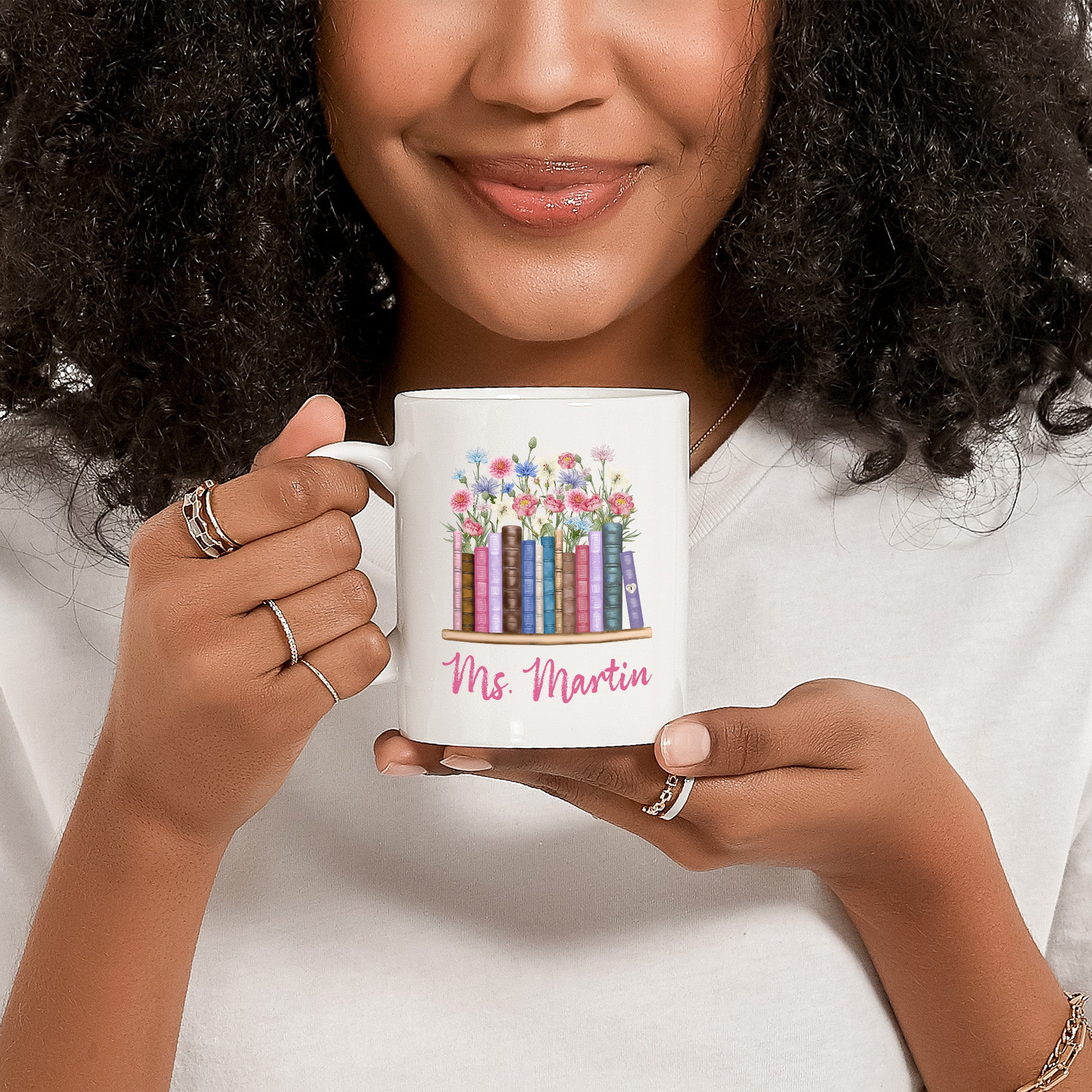 Woman holding personalized boho floral teacher mug with custom name, perfect teacher appreciation gift.