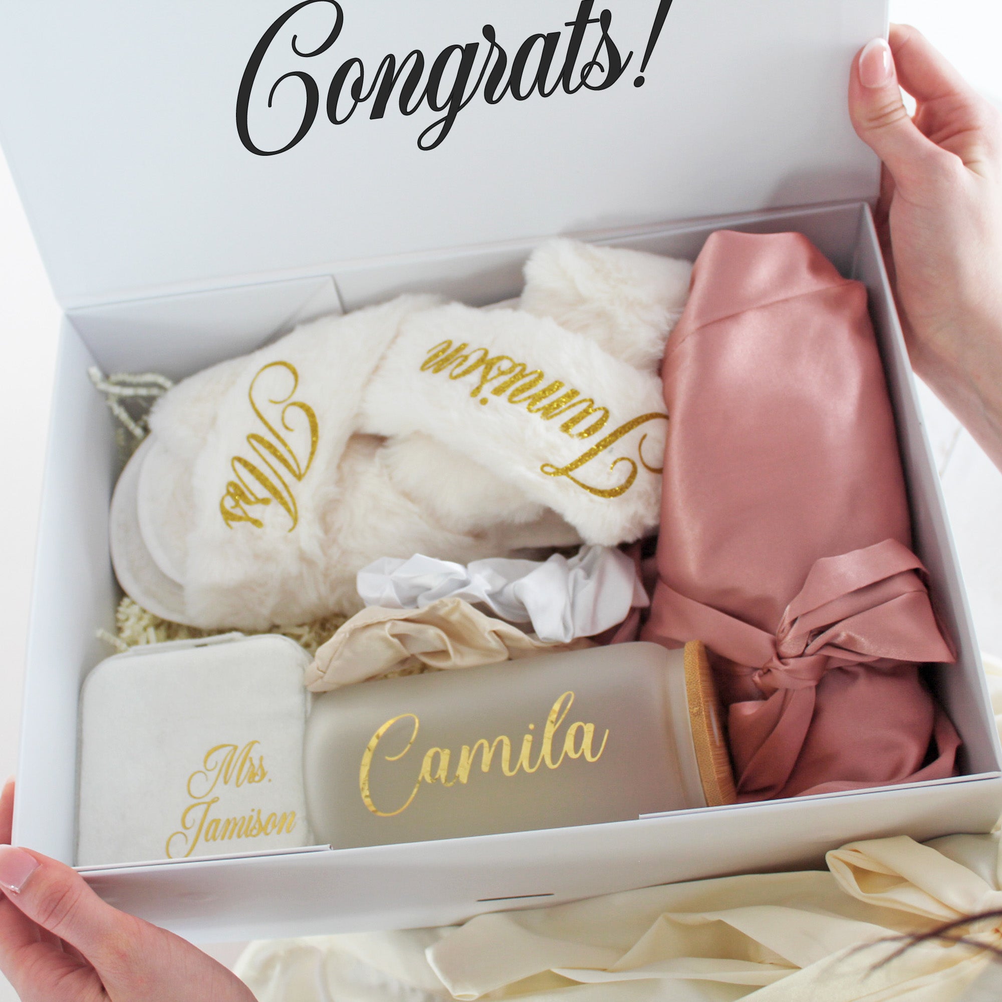 Custom bridesmaid gift set featuring a robe with name, slippers, Libbey can glass, and scrunchies for bridal party proposals. 