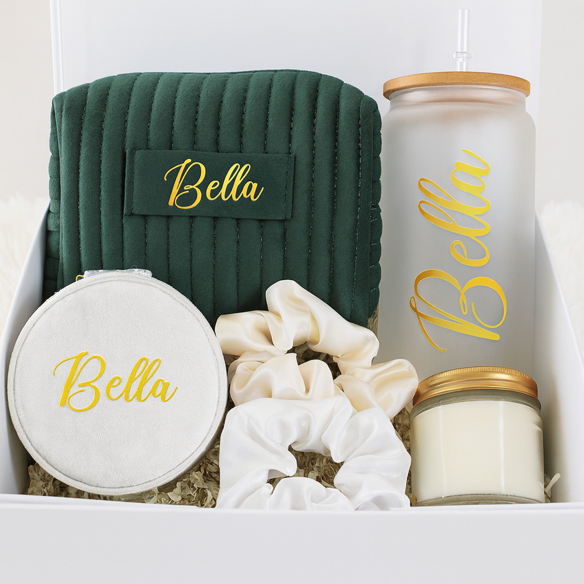 Dark green and gold them bridesmaid proposal box gift set. The perfect will you be my bridesmaid box with a personalized makeup bag, custom frosted glass can, a personalized velvet jewelry box, 2 scrunchies and a gold lid candle.