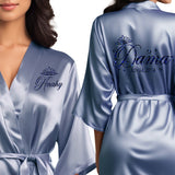 Dusty blue quinceanera robes for damas. Beautiful satin dusty blue quince robes with black glitter design.