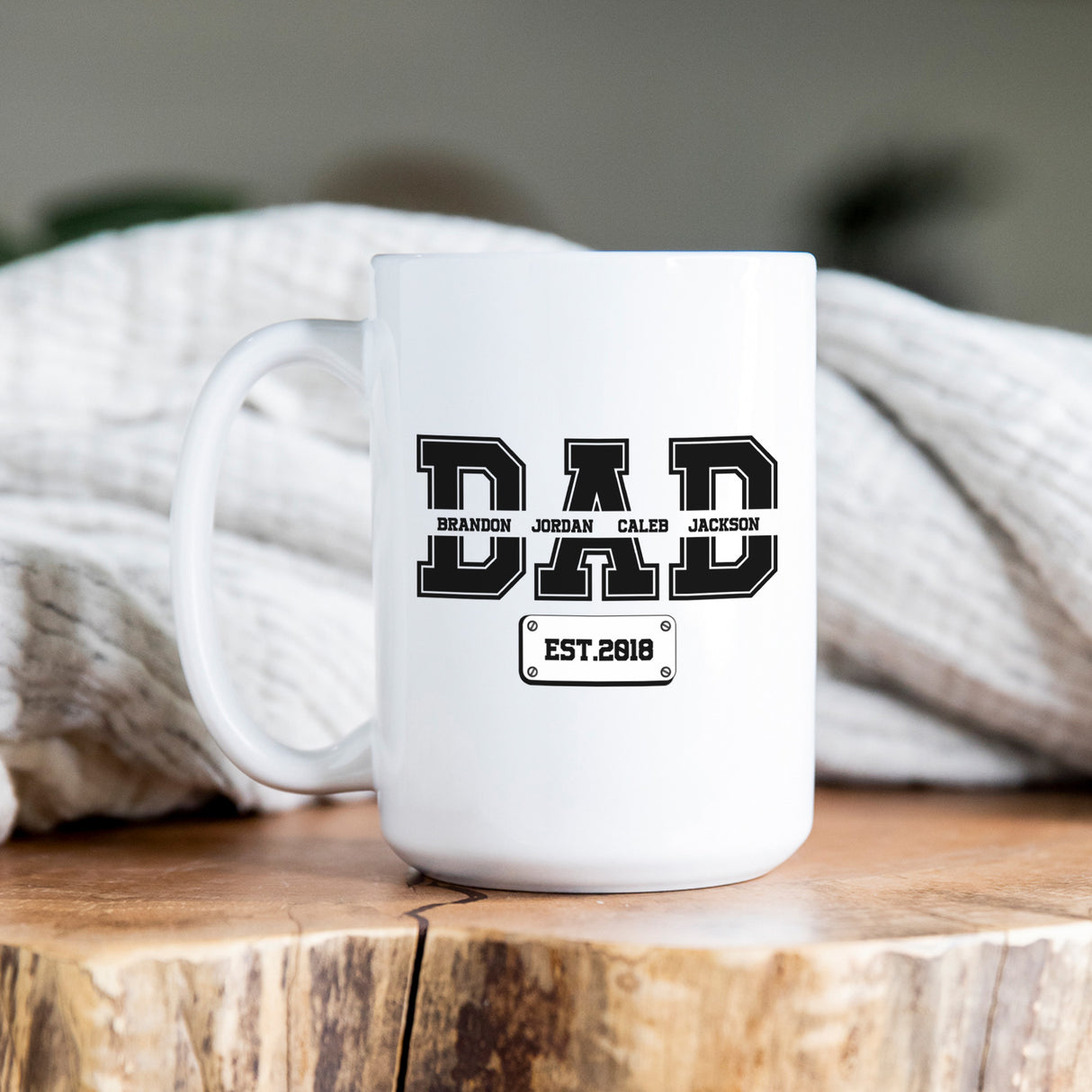 Custom dad mug with children’s names and year in varsity lettering, perfect personalized Father’s Day gift from kids or spouse.