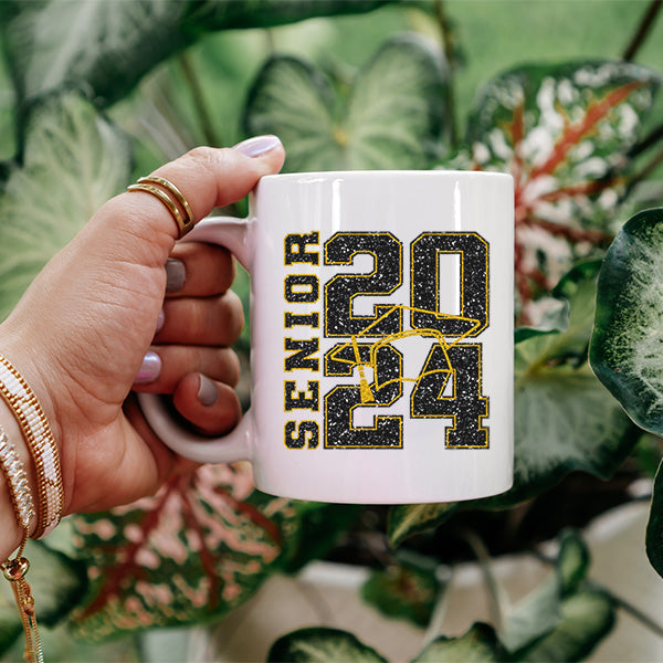 Woman holding Senior 2024 graduate coffee mug. All SKUs. 