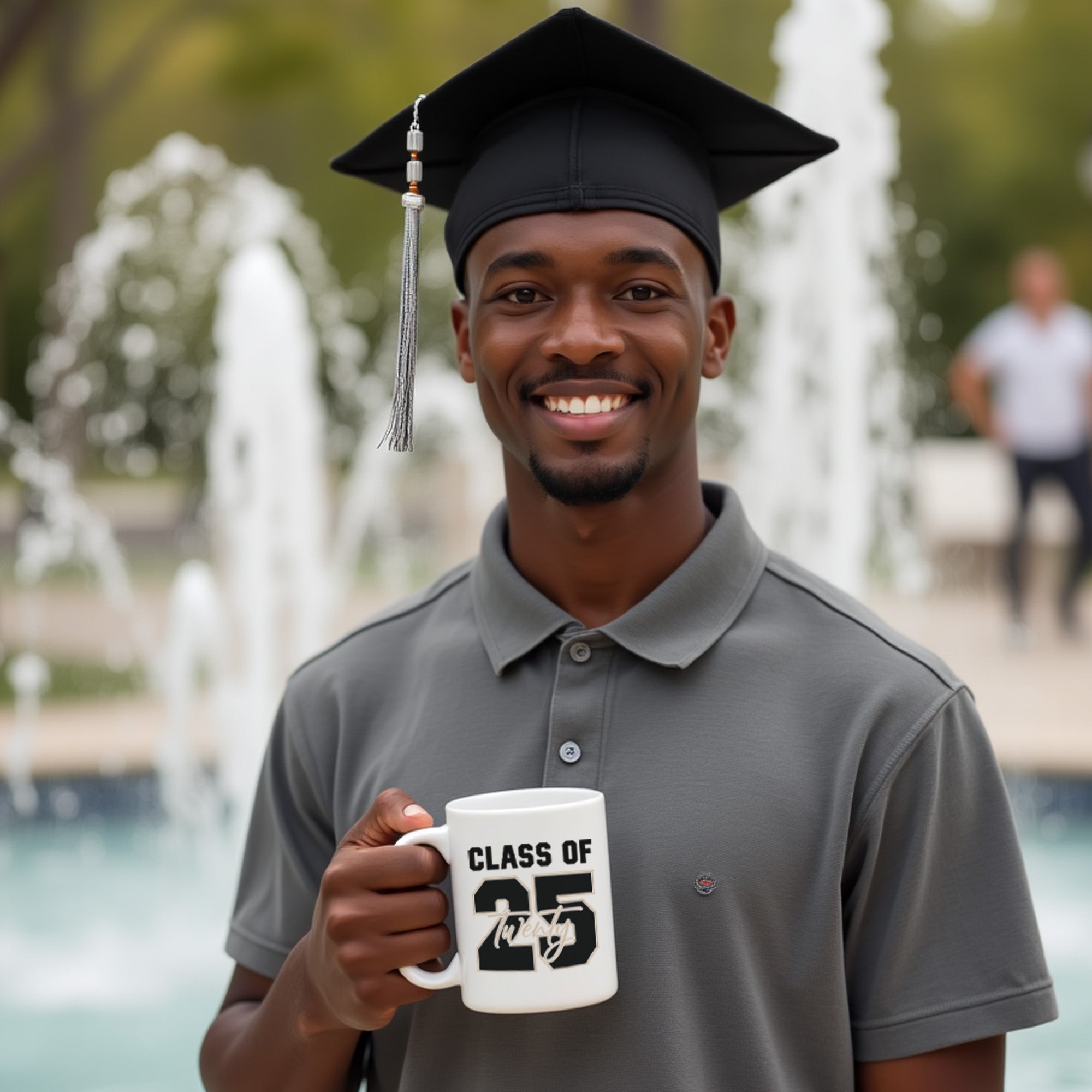 College graduate holding up graduation gift mug with the class of 2025 design. 