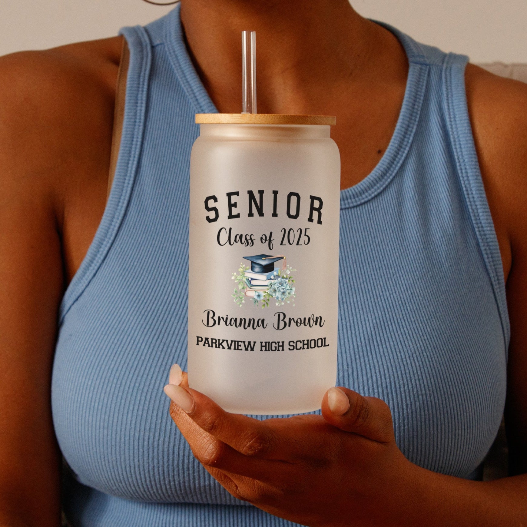 Floral frosted glass iced coffee cup personalized with name, year, school, and floral design as a perfect Class of 2025 graduation keepsake.