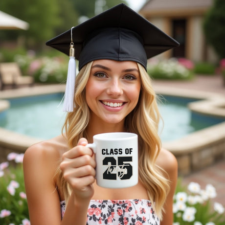 Teen girl holding adorable graduation mug. Graduation ceremony gift ideas for her from parents. 