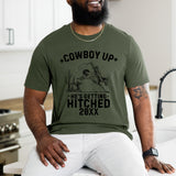 Custom he's getting Cowboy Up t-shirt featuring bold western-theme, perfect personalized bachelor party outfit for wedding crews.