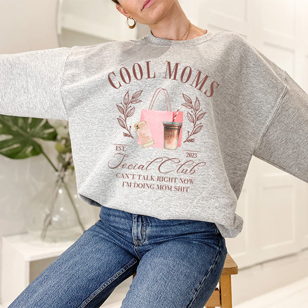 Cute cool moms club sweatshirt for moms on mothers day and any other special occasion. All SKUs.