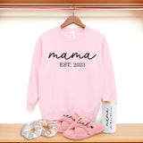 Cute gift bundle for mom with custom Mama sweatshirt, fluffy slippers, Libbey glass coffee can, and scrunchies. The best gift basket for mom. Personalized birthday gift for moms.