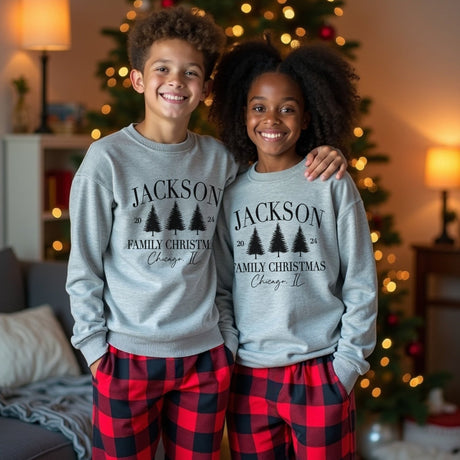 Cute youth Christmas pajamas and sweatshirt set personalized with last name and location. 