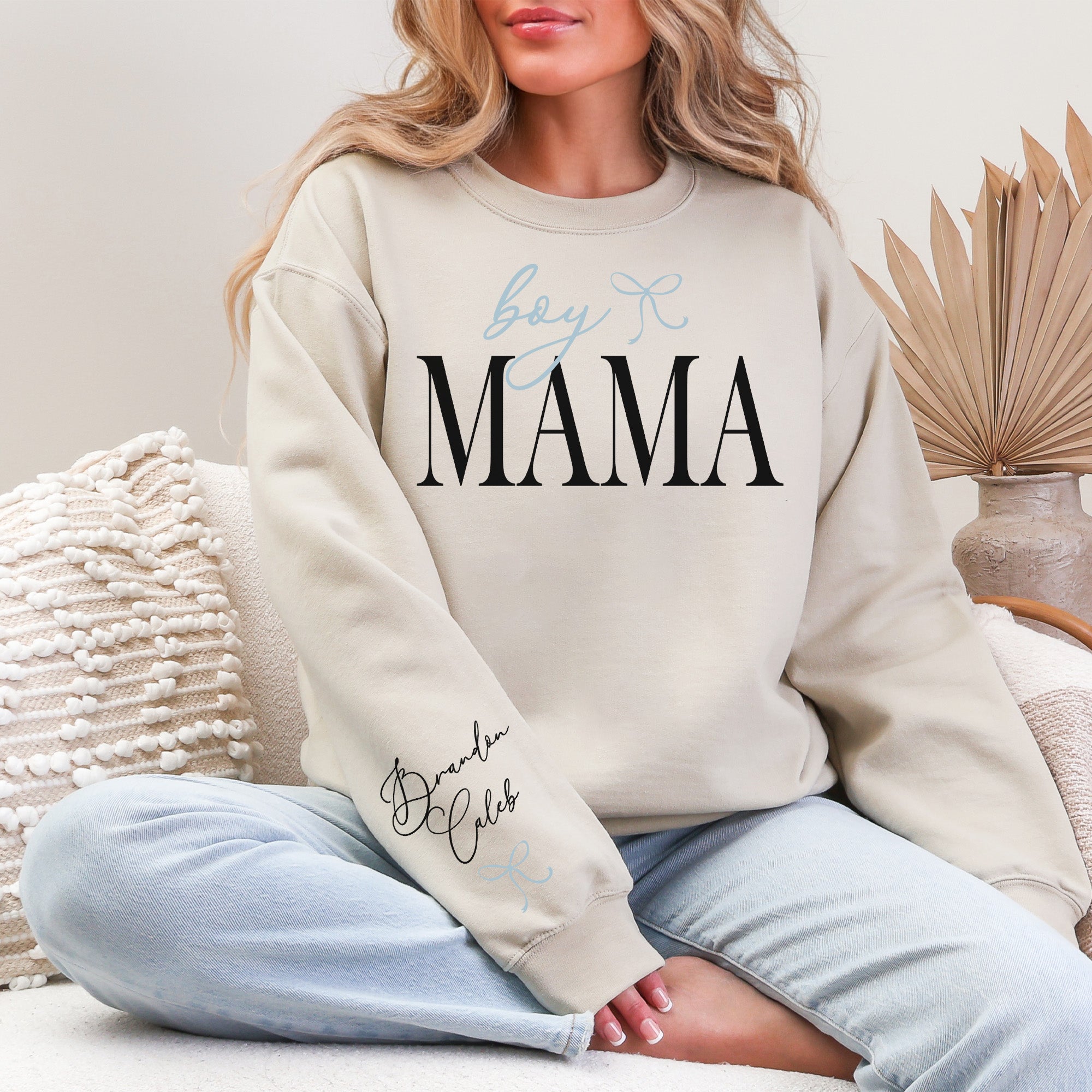 Mom wearing custom Boy Mama Sweatshirt personalized with kids names stylish sweatshirt for moms. 