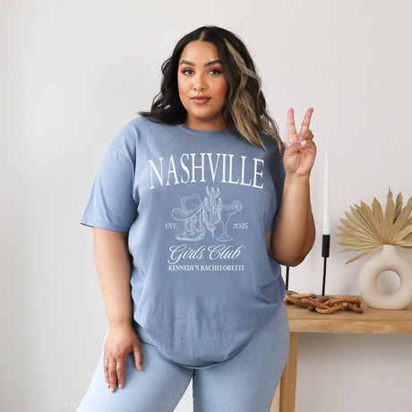 Blue country chic bachelorette apparel featuring personalized Comfort Colors shirt with cowboy hat design. 