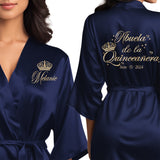 Front and back personalized satin quinceanera robes at knee length. Abuela de la quinceanera getting ready robes.