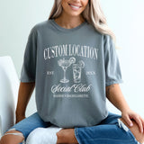 Custom Comfort Colors bachelorette party shirts with personalized location and Social Club design, perfect matching shirts for bride and bridesmaids.