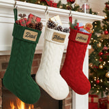 Cute cable knit personalized Christmas stockings for family with name and leather patch. in colors dark green, white and red. Great for friend's holiday parties.