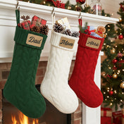 Cute cable knit personalized Christmas stockings for family with name and leather patch. in colors dark green, white and red. Great for friend's holiday parties.