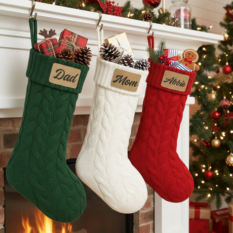 Cute cable knit personalized Christmas stockings for family with name and leather patch. in colors dark green, white and red. Great for friend's holiday parties.