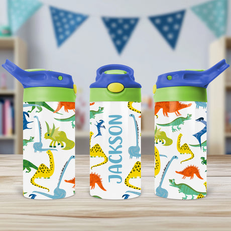 Personalized dinosaur water bottle for kids with custom name and flip top lid, ideal for school, toddlers, daycare, and back-to-school use.

