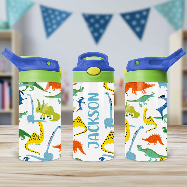 Personalized dinosaur water bottle for kids with custom name and flip top lid, ideal for school, toddlers, daycare, and back-to-school use.

