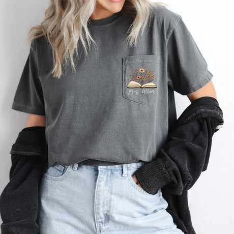 Floral Comfort Colors teacher shirt with personalized name. Book with flowers design, the perfect gift for female teachers. 