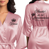 Front and back personalized satin quinceanera robes at knee length. Abuela de la quinceanera getting ready robes.