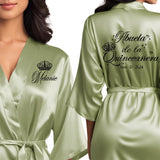 Front and back personalized satin quinceanera robes at knee length. Abuela de la quinceanera getting ready robes.