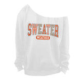 White Off The Shoulder Sweatshirt with Sweater Weather graphics.