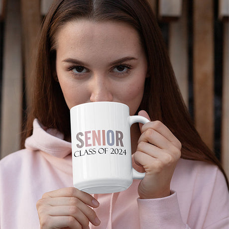 Woman holding senior class of 2024 coffee mug. This coffee mug is a great gift for her on graduation. All SKUs. 