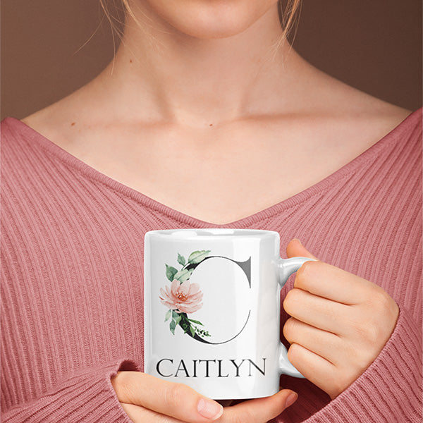 Closeup view of personalized mug with the letter C and the name Caitlyn in block font.  all SKUs