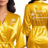 Satin yellow gold quince robes with white glitter. Madrina de la quinceanera getting ready robes.