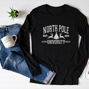 Flat Lay of North Pole University Long Sleeve Tshirt in Black with white lettering and design.  all SKUs