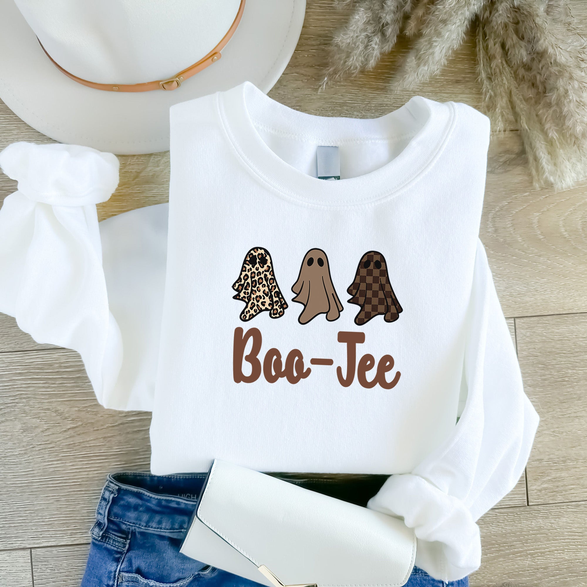 Halloween sweatshirt for women in various colors and sizes.  This design showcases three small friendly ghosts wearing leopard and plaid prints. all SKUs