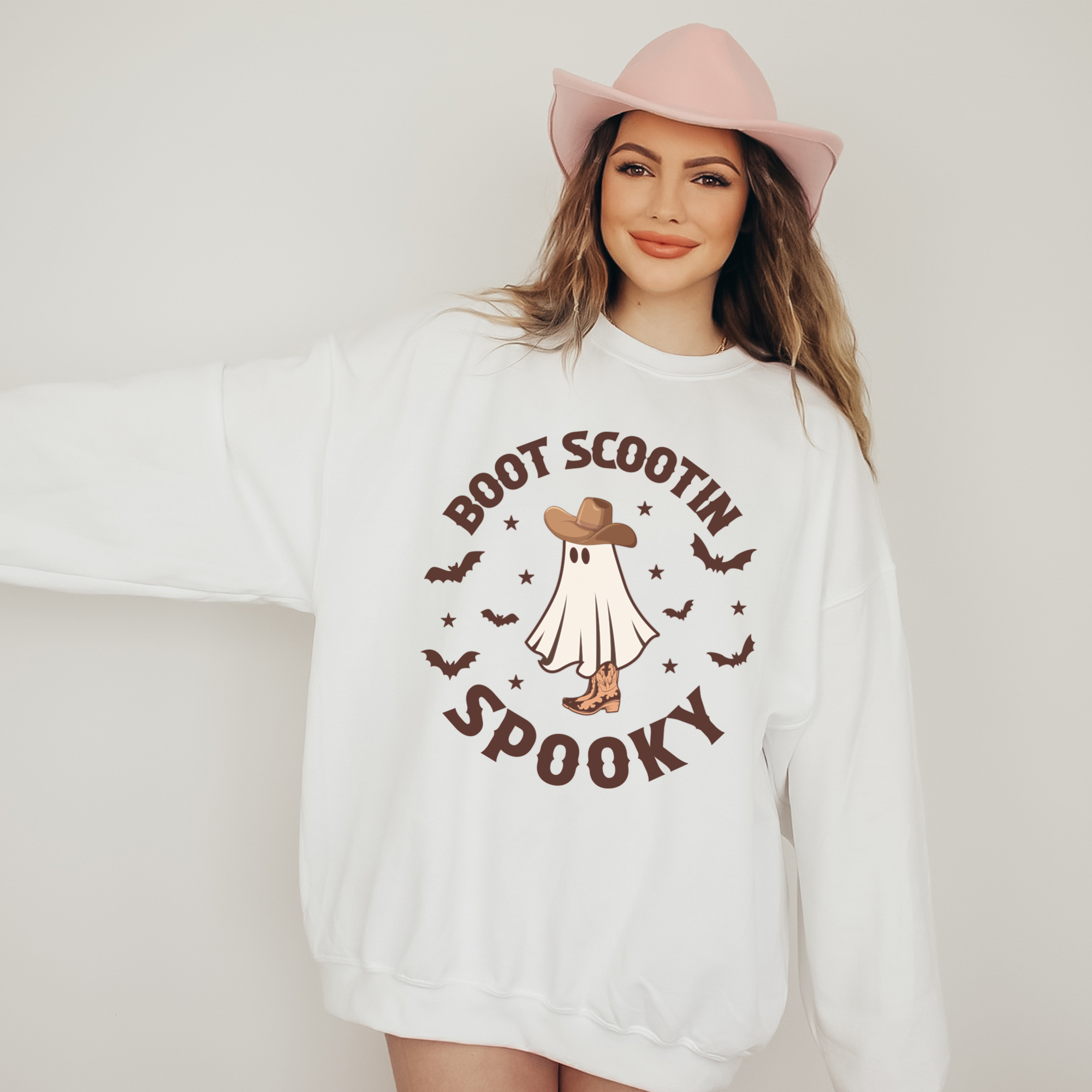 Halloween Sweatshirt with a ghost dressed in cowgirl hat and cowgirl boots for that western style. all SKUs